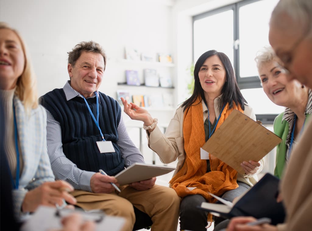 Group of people in a meeting talking to each other