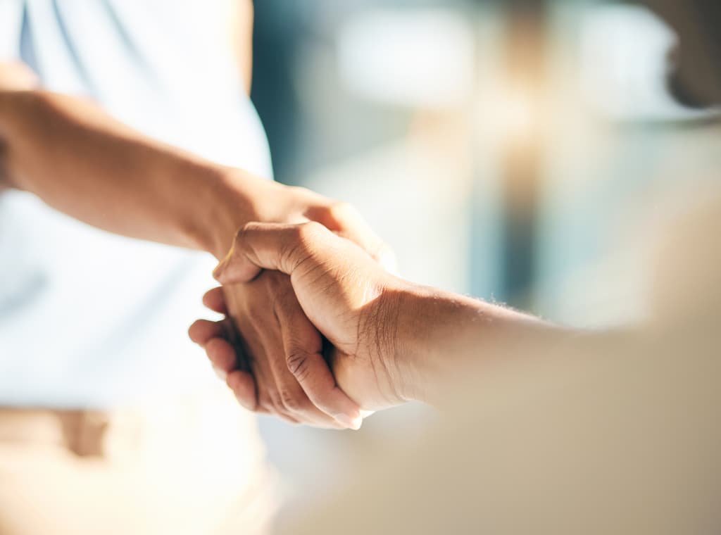 woman and man handshake